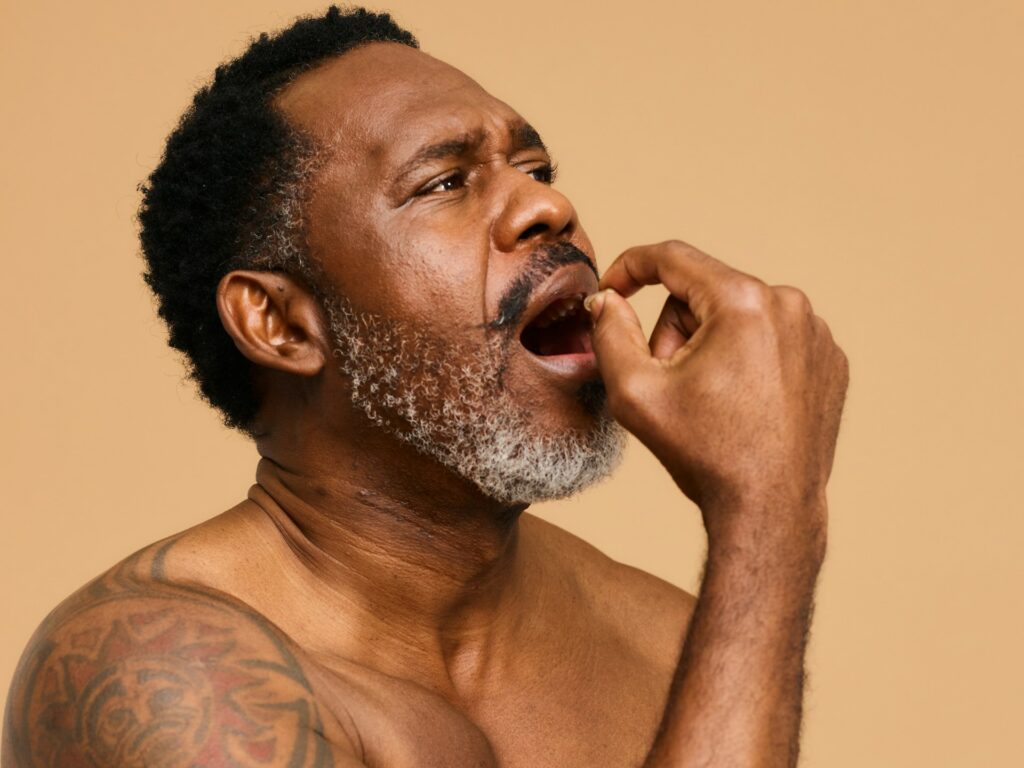 man taking supplements