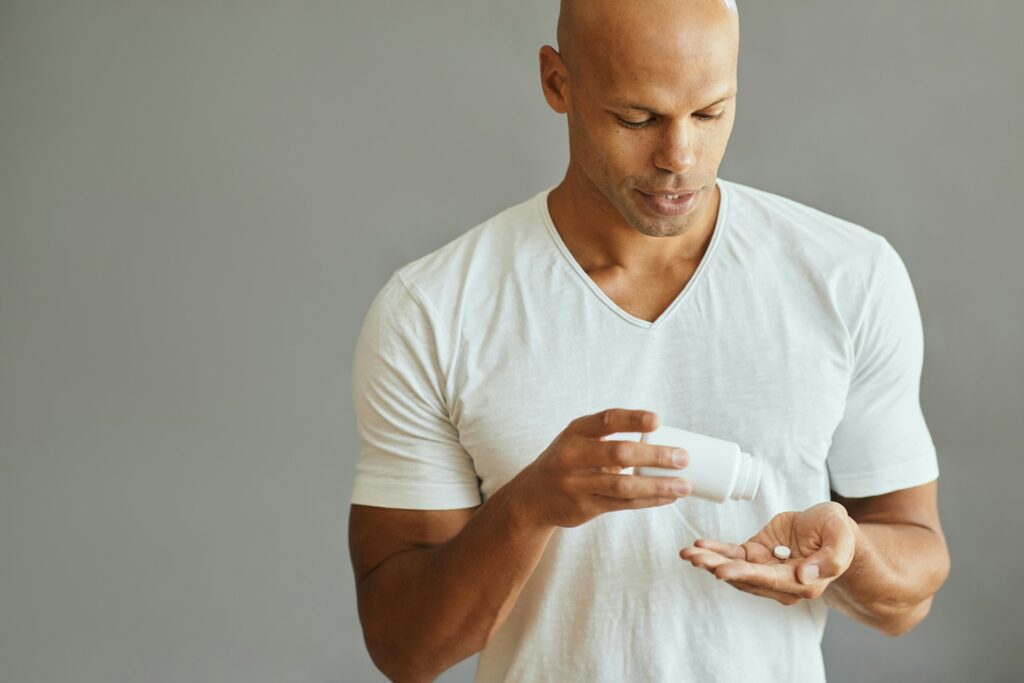 man taking supplements