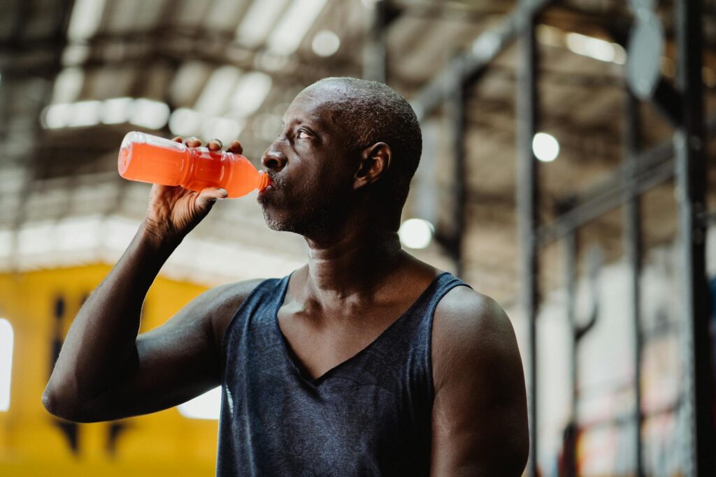 man drinking electrolytes