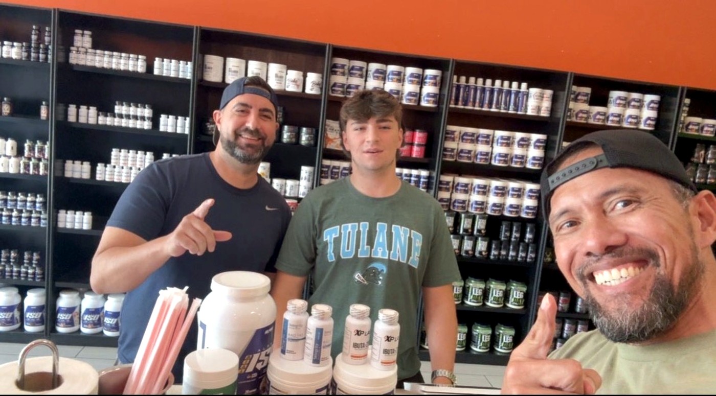 A father and son shopping together at Xtreme Performance Nutrition