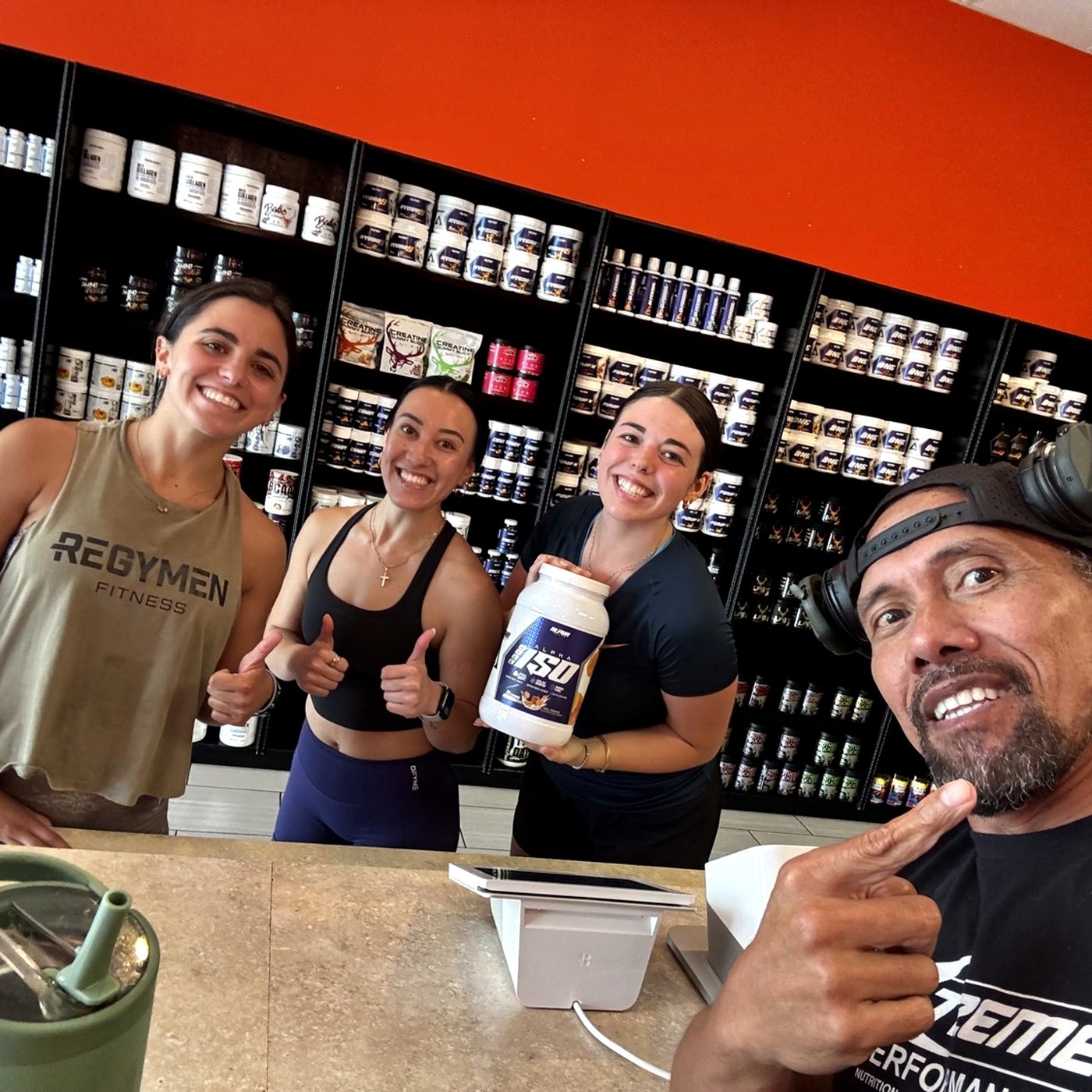 Three Regymen members restocking at Xtreme Performance Nutrition